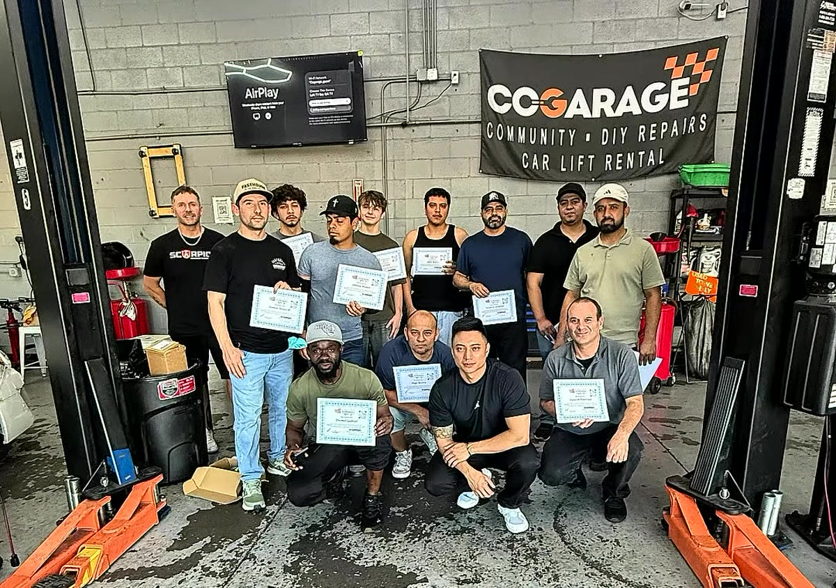 Window tint course Los Angeles - Tint Academy students holding their certificates at COGARAGE, El Monte CA
