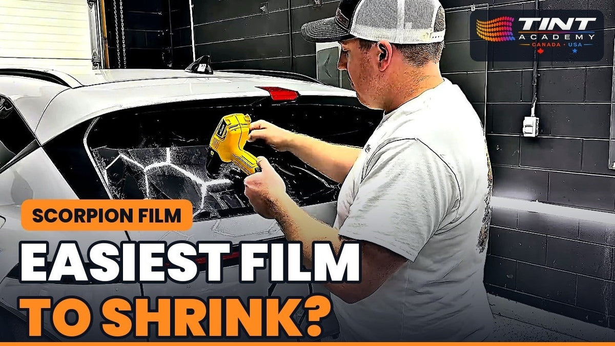 Window tint school in Indiana - Tint Academy instructor heat shrinking Scorpion film on a rear windshield